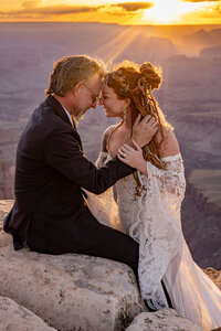 A bride and groom share a kiss after their intimate elopement ceremony on the Grand Canyon South Rim.