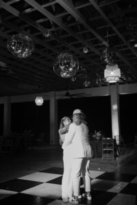 black and white photo of couple doing their last dance