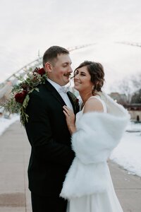 Newlyweds hugging and smiling at each other
