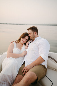 Couples session in field at sunset