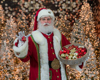 Santa Claus meets a cat at the Santa Experience in Phoenixville