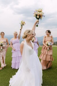 Wedding party celebrating outdoors at Echo Mountain wedding in Idaho Springs, Colorado.
