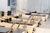 Pilates reformers lined up in a Utah studio.