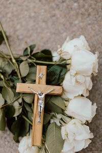 catholic crucifix and flowers