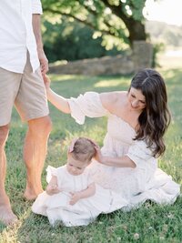 family standing in front of stone wall