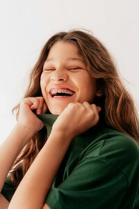 Laughing girl with green sweater