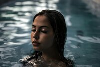 Girl swimming in a luxurious pool at Aspria, highlighting wellness and fitness facilities, captured as part of Muse Studio’s branding and social media campaign.