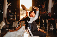 Wedding Photography in Salem, couple throwing each other's shoes over their shoulders
