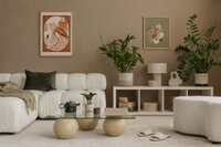 A living rom with white couch and plants