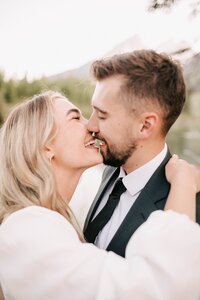 bride and groom holding each other close about to kiss after their teton elopement.