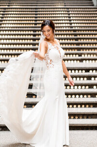 bride posing and twirling with wedding dress