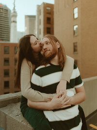 bride and groom holding eachother