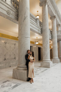 bride and groom walking together during wedding portraits