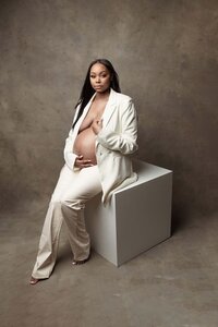 Professional maternity portrait of woman in blazer