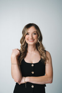 Katlyn, lead wedding planner at Blush Events in Wichita, Kansas, smiling in professional portrait.