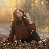 senior girl in fall leaves