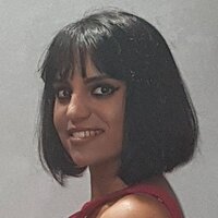 Roshni, a young brown woman with a 1920s style bob