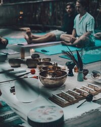 A sacred altar space at Kaaba Luum Retreats in Tulum, surrounded by lush jungle, featuring ceremonial offerings, candles, and ancestral elements used for spiritual healing and deep inner work.
