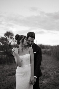 man hugging woman in field