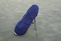 Water resistant golf bag cover by Over Armor Golf standing on golf course