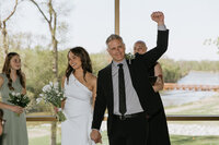 Bride and groom laughing close together  taken by fargo wedding photographer kiella lawrence