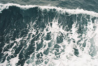 Waves crashing on film photography.