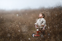 Adorable photos of a boy admiring snow flurries in Virginia Beach.