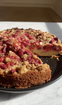 cranberry coffee cake on black plate