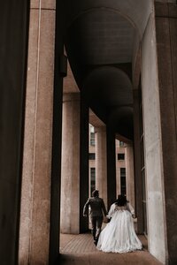 Bride and groom walking through a BC wedding venue
