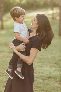 mom and son smile at each other