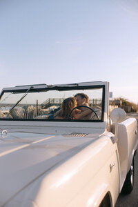 luxury car shot with couple inside