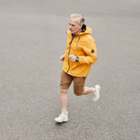 A senior man running on the street