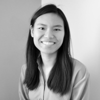 Black and White photo of an asian american woman smiling