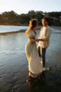 A couple dances on Muir Beach in California