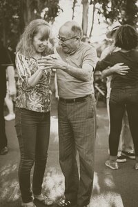 A couple dancing outside at a party