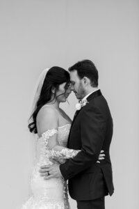 Bride and groom hugging each other during bridal portraits