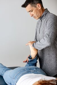 Chris Warden, founder of Embody Health & Performance, Doctor of Physical Therapy working with a patient on mobility