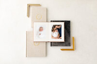 Beautiful heirloom albums with newborn portraits taken by Missy Marshall