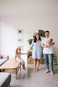 family sitting on couch together