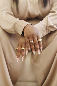 woman sitting with hands crossed