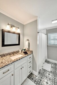 Master bathroom in this four-bedroom, three-bathroom vacation rental home with game room, spa, and firepit located on the edge of Waco, TX.