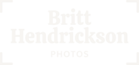 The words "Britt Hendrickson Photos" are center-aligned in camera framing marks. The logo is white.