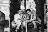 Grooms pose with dog ring bearer at LGBTQ+ Colorado mountain wedding.