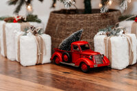 Mother gives daughters a kiss outside while embracing together