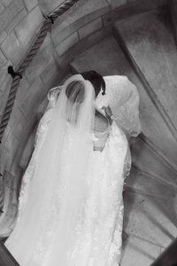 bride walking up spiral staircase