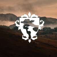 White crest-style logo with a stylized world map on a scenic background of mountains and trees.