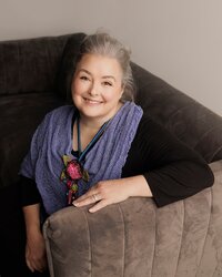 Modern headshot in Austin, Texas, highlighting a confident and approachable individual with a natural expression, soft lighting, and a clean, professional backdrop.