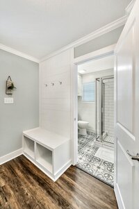 Main floor bathroom in this four-bedroom, three-bathroom vacation rental home with game room, spa, and firepit located on the edge of Waco, TX.