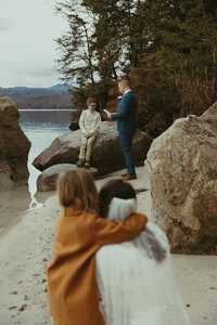 Documentary candid shot of the Groom hanging out with his children on his wedding day, Intimate Wedding, Elopement, and Family Photography NYC and Western North Carolina Area