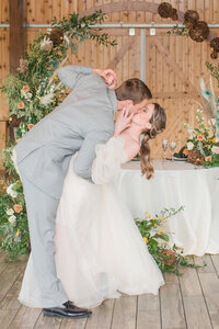 Bride and groom dancing dip reception at their mount ida farm wedding